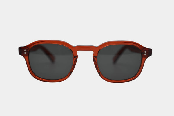 Elevate your style with Frantistek Sunglasses in Rust Orange. Crafted meticulously from sustainable Mazzucchelli bioacetate, these shades redefine eco-luxury. Their classic retro frame transcends trends, embodying timeless elegance. Size: 49mm-23mm, Temple: 145mm. Make a responsible fashion choice and embrace enduring style- front angle