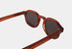 Elevate your style with Frantistek Sunglasses in Rust Orange. Crafted meticulously from sustainable Mazzucchelli bioacetate, these shades redefine eco-luxury. Their classic retro frame transcends trends, embodying timeless elegance. Size: 49mm-23mm, Temple: 145mm. Make a responsible fashion choice and embrace enduring style- side angle