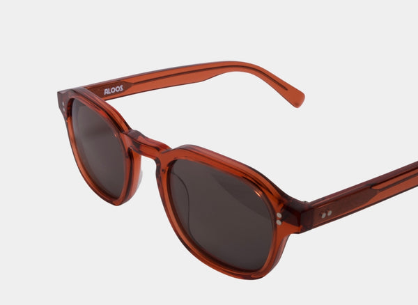 Elevate your style with Frantistek Sunglasses in Rust Orange. Crafted meticulously from sustainable Mazzucchelli bioacetate, these shades redefine eco-luxury. Their classic retro frame transcends trends, embodying timeless elegance. Size: 49mm-23mm, Temple: 145mm. Make a responsible fashion choice and embrace enduring style- transverse angle