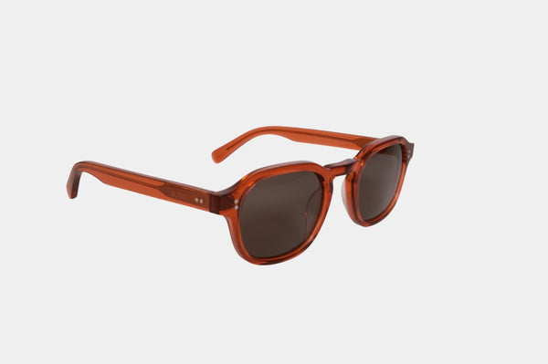Elevate your style with Frantistek Sunglasses in Rust Orange. Crafted meticulously from sustainable Mazzucchelli bioacetate, these shades redefine eco-luxury. Their classic retro frame transcends trends, embodying timeless elegance. Size: 49mm-23mm, Temple: 145mm. Make a responsible fashion choice and embrace enduring style